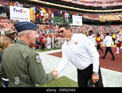 Major Gen. Joel Jackson, Air Force District of Washington commander, shakes hands with Ron Rivera, Washington Commanders’ head football coach, at Fedex Field in North Englewood, Md., Sept. 25, 2022. As a continuation of the celebration of the United States Air Force, Gen. Jackson was named honorary captain of the Washington Commanders for the Sept. 25 Washington Commanders game and was honored during the opening coin-toss. Stock Photo