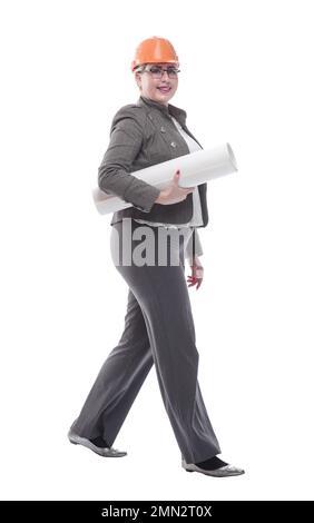 female architect with a roll of drawings striding towards you Stock Photo