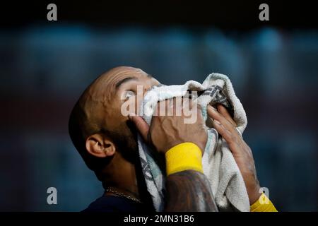 Milwaukee Brewers' Eric Thames stands in the dugout in the fourth