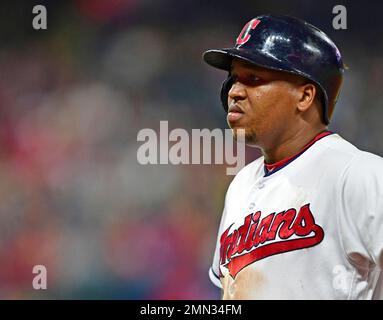 Cleveland Indians Jose Ramirez stands next to New York Yankees Aaron Judge  who puts his thumb down when he reacts after driving in 2 runs with a  double in the 3rd inning