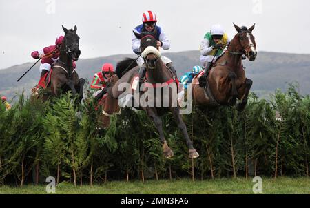 Race Three. The Glenfarclas Cross Country Chase.   Jumping the last, l2r Delta Work ridden by Robert James, Back On The Lash ridden by Sean Bowen and Stock Photo