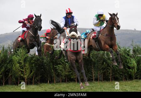 Race Three. The Glenfarclas Cross Country Chase.   Jumping the last, l2r Delta Work ridden by Robert James, Back On The Lash ridden by Sean Bowen and Stock Photo