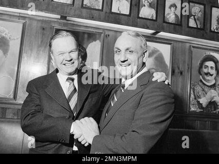 Bert Bell, commissioner of the NFL, holds football near photo mural of  Yankee Stadium in the New York Yankees' downtown office, Jan. 27, 1956. The New  York Giants of the NFL announced