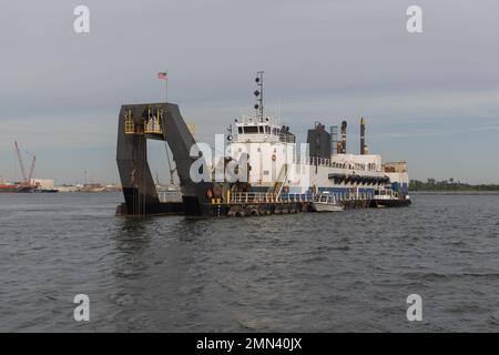 The dredge Savannah works to deepen the navigation channel of the Cooper River in Charleston, S.C. on September 27, 2022. The channel dredging is part of the Charleston Harbor Post 45 Deepening Project, which will make the Charleston Harbor deeper and wider to accommodate larger ships to call on the Port of Charleston. The project will make the channel the deepest on the East Coast of the United States at 52 feet. Stock Photo