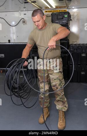 Airmen with the 255th Air Control Squadron, 172nd Airlift Wing, Mississippi Air National Guard, inspect and pack equipment at the Gulfport Combat Readiness Training Center, Gulfport, Miss., September 28, 2022. The Airmen are preparing to deploy to Florida in support of Hurricane Ian recovery. Stock Photo