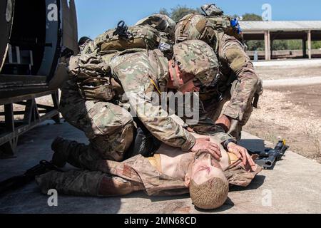 Staff Sgt. Caleb Stinson and Sergeant 1st Class Jason Pate, 68W Combat Medics, 232nd Medical Battalion, conduct damage control and resuscitation during the Best Medic Competition, Sep. 29, 2022 at Joint Base San Antonio-Camp Bullis, Tx. Medics who earn entry into the Best Medic Competition are already among the 'best of the best.' To be eligible for entry, medics must have received either the Expert Field Medical Badge (EFMB) or the Combat Medical Badge (CMB).2 Both badges require the utmost determination and competence to receive. The overall pass rate for the Expert Field Medical Badge is le Stock Photo