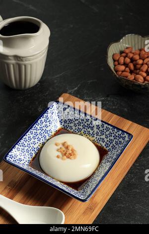 Tofu Pudding or Jimami Tofu, Okinawa Japan Traditional Food. Sprinkle with CHopped Nuts on Dofu Pudding Stock Photo