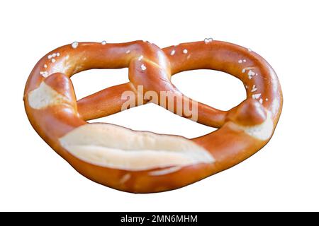Brezel lies in a plate on a wooden table in a cafe, isolated on a white background Stock Photo
