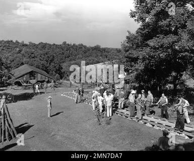 FRED MacMURRAY and MADELEINE CARROLL on set location candid with Movie / Camera Crew filming tracking shot with huge Technicolor Camera during filming of VIRGINIA 1941 director / story EDWARD H. GRIFFITH story / screenplay Virginia Van Upp cinematography Bert Glennon and William V. Skall Paramount Pictures Stock Photo