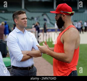 Philadelphia Phillies' Jake Arrieta, left, listens to former teammate  Chicago Cubs' Anthony Rizzo before a baseball game against the two clubs  Tuesday, June 5, 2018, in Chicago. (AP Photo/Charles Rex Arbogast Stock