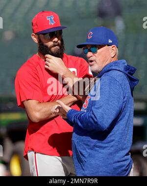 Philadelphia Phillies' Jake Arrieta, left, listens to former teammate  Chicago Cubs' Anthony Rizzo before a baseball game against the two clubs  Tuesday, June 5, 2018, in Chicago. (AP Photo/Charles Rex Arbogast Stock