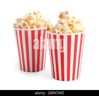 Buckets with tasty popcorn on red background Stock Photo - Alamy