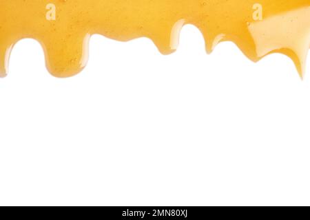 Fresh sweet honey flowing on white background Stock Photo