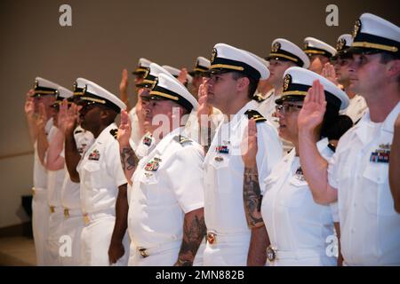 NEWPORT, RI. (Sept. 30, 2022) Limited Duty Officer/Chief Warrant Officer (LDO/CWO) Academy class 22120 students at Officer Training Command Newport (OTCN), reaffirm the oath of office during their graduation ceremony, Sept. 30, 2022. The LDO/CWO community supports the warfighting capability and readiness of Naval forces through leadership, technical proficiency, and experience. Stock Photo