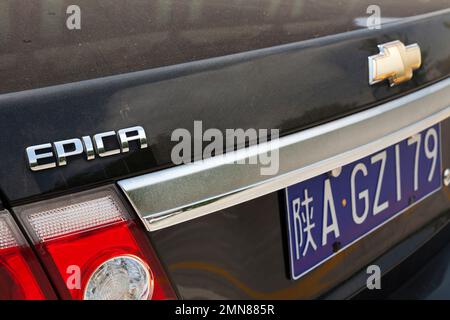 Rear with numberplate and model, and some information written in Chinese characters / writing Chevrolet Epica car / vehicle in China.  Xian, PRC. (125) Stock Photo