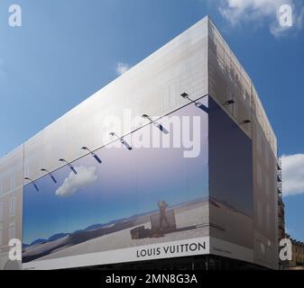 Man walking by Louis Vuitton Billboard Stock Photo - Alamy