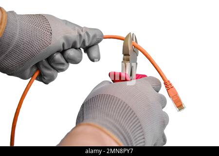 Cutting a computer network wire with wire cutters, isolated on a white background Stock Photo