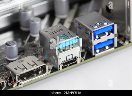 Multiple ports on modern computer mainboard show with Display port, USB 3.2 type A and type C, usb 3.1. Stock Photo