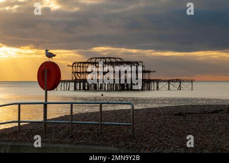 Sunset at the West Pier ruins on Brighton beach, East Sussex, England. Stock Photo