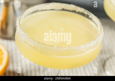 Boozy Refreshing Meyer Lemon Drop Martini with a Sugar Rim Stock Photo