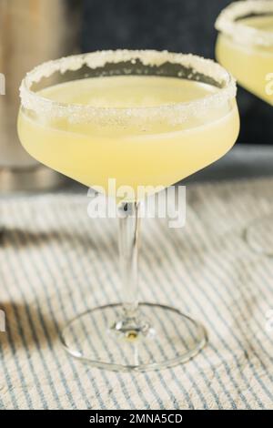 Boozy Refreshing Meyer Lemon Drop Martini with a Sugar Rim Stock Photo