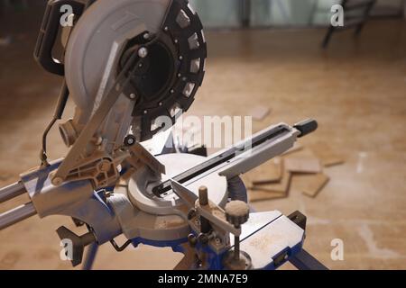 Electric circular saw on stand for cutting tiles close up. Stock Photo