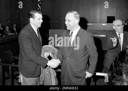 George Halas, owner-president of the Chicago Bears, seems to have some  interested listeners in Jack Jennings, center, of the Chicago Cardinals,  and Chuck Bednarik, right, of the Philadelphia Eagles, as they wait