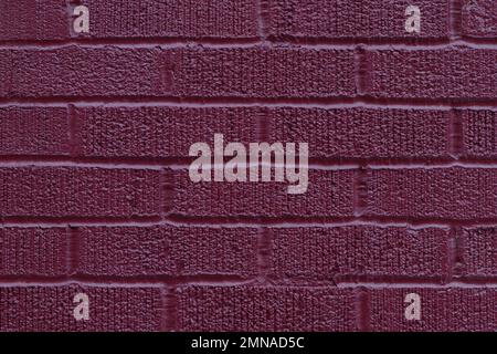 Painted dark pink brick wall texture vertical background Stock Photo