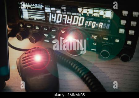 Radio transciever broadcasting station - amateur radio - flares and flash in the background Stock Photo