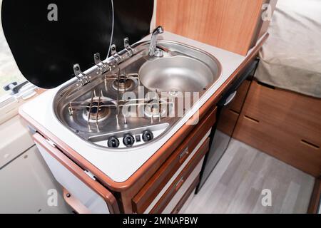 Camper van Kitchen in motorhome mobile house with modern sink Stock Photo