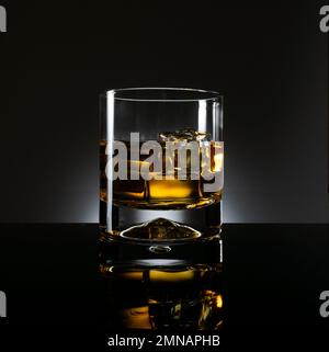 Glass of whiskey isolated on a black background Stock Photo