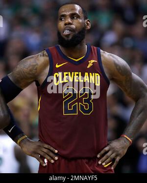 Cleveland Cavaliers' LeBron James waits during a timeout in the