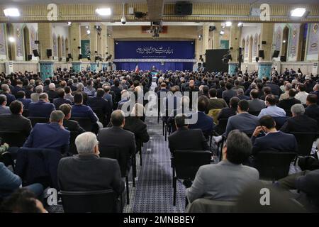 Tehran, Tehran, Iran. 30th Jan, 2023. This handout picture provided by the office of Iran's Supreme Leader Ayatollah ALI KHAMENEI shows him in a meeting with a large group of Iranian entrepreneurs, manufacturers, and knowledge-based companies in the Imam Khomeini Hussainiyah in Tehran on, January 30, 2023. The Leader of the Islamic Revolution stressed on ''rapid, continuous economic growth'' as the current necessity for the country. Khamenei announced that the bright future of the country is in need of rapid and continuous economic growth. The Leader explained the reasons and requirements fo Stock Photo