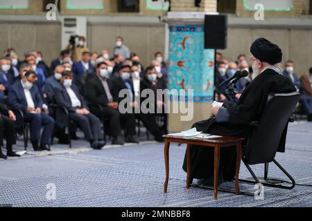 Tehran, Tehran, Iran. 30th Jan, 2023. This handout picture provided by the office of Iran's Supreme Leader Ayatollah ALI KHAMENEI shows him in a meeting with a large group of Iranian entrepreneurs, manufacturers, and knowledge-based companies in the Imam Khomeini Hussainiyah in Tehran on, January 30, 2023. The Leader of the Islamic Revolution stressed on ''rapid, continuous economic growth'' as the current necessity for the country. Khamenei announced that the bright future of the country is in need of rapid and continuous economic growth. The Leader explained the reasons and requirements fo Stock Photo