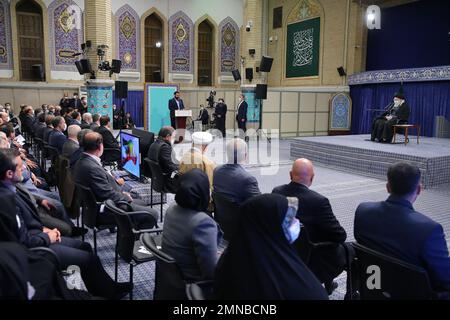 Tehran, Tehran, Iran. 30th Jan, 2023. This handout picture provided by the office of Iran's Supreme Leader Ayatollah ALI KHAMENEI shows him in a meeting with a large group of Iranian entrepreneurs, manufacturers, and knowledge-based companies in the Imam Khomeini Hussainiyah in Tehran on, January 30, 2023. The Leader of the Islamic Revolution stressed on ''rapid, continuous economic growth'' as the current necessity for the country. Khamenei announced that the bright future of the country is in need of rapid and continuous economic growth. The Leader explained the reasons and requirements fo Stock Photo