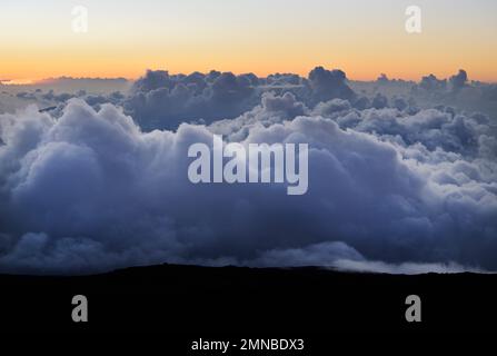 Clouds at sunset from Haleakala Volcano, Maui Stock Photo