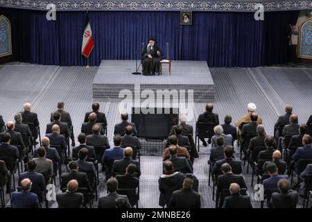 Tehran, Tehran, Iran. 30th Jan, 2023. This handout picture provided by the office of Iran's Supreme Leader Ayatollah ALI KHAMENEI shows him in a meeting with a large group of Iranian entrepreneurs, manufacturers, and knowledge-based companies in the Imam Khomeini Hussainiyah in Tehran on, January 30, 2023. The Leader of the Islamic Revolution stressed on ''rapid, continuous economic growth'' as the current necessity for the country. Khamenei announced that the bright future of the country is in need of rapid and continuous economic growth. The Leader explained the reasons and requirements fo Stock Photo