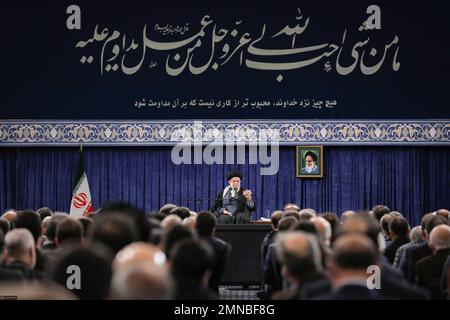 Tehran, Tehran, Iran. 30th Jan, 2023. This handout picture provided by the office of Iran's Supreme Leader Ayatollah ALI KHAMENEI shows him in a meeting with a large group of Iranian entrepreneurs, manufacturers, and knowledge-based companies in the Imam Khomeini Hussainiyah in Tehran on, January 30, 2023. The Leader of the Islamic Revolution stressed on ''rapid, continuous economic growth'' as the current necessity for the country. Khamenei announced that the bright future of the country is in need of rapid and continuous economic growth. The Leader explained the reasons and requirements fo Stock Photo