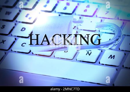 Hacked symbol on computer keyboard with open padlock Stock Photo