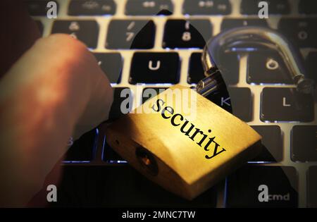 Security text on computer keyboard with open padlock Stock Photo
