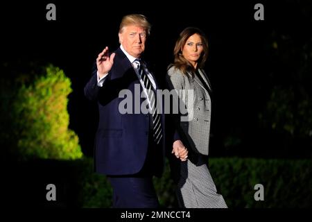 President Donald Trump, with first lady Melania Trump, leaves the White House in Washington, early Thursday, May 10, 2018, to greet three freed Americans detained in North Korea for over a year, who are arriving at Joint Base Andrews, Md. (AP Photo/Manuel Balce Ceneta)
