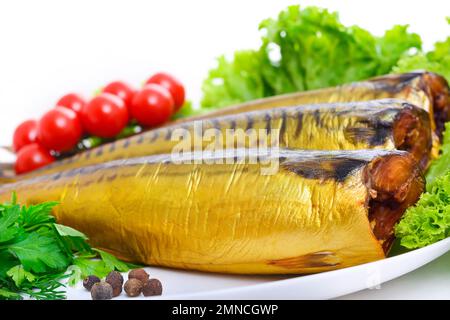 Appetizing smoked fish on a platter Stock Photo