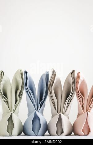Easter bunny ear napkins on white backdrop with place for text. Stock Photo