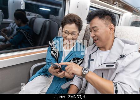 Happy elderly couple take the subway Stock Photo