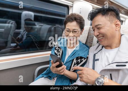 Happy elderly couple take the subway Stock Photo