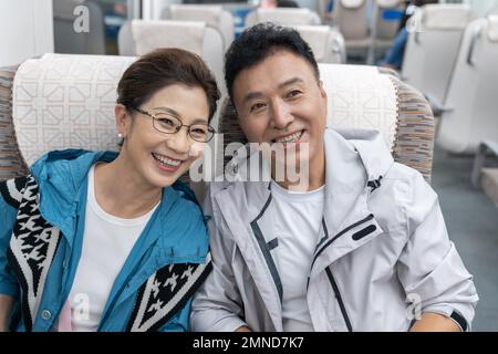 Happy elderly couple take the subway Stock Photo