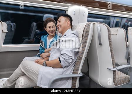 Happy elderly couple take the subway Stock Photo