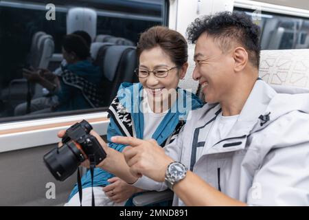 Happy elderly couple take the subway Stock Photo