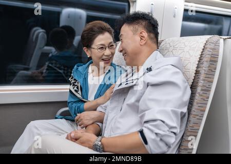 Happy elderly couple take the subway Stock Photo