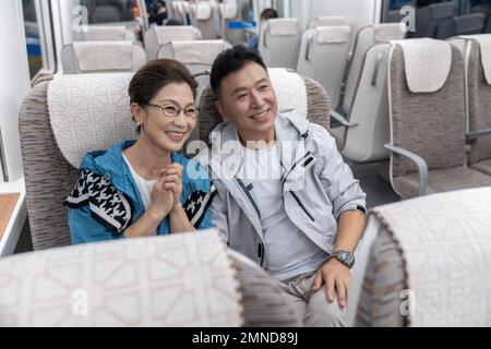 Happy elderly couple take the subway Stock Photo